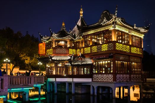 Shanghai, China - April 7, 2013: ancient tea house Fang Bang Zhong Lu old city at night in the city of Shanghai in China on april 7th, 2013