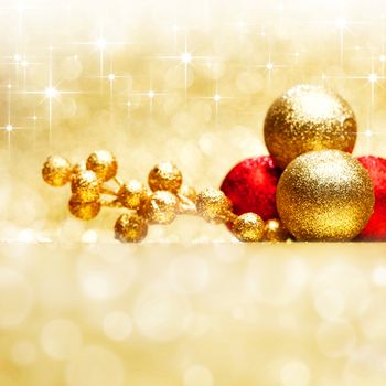 Colorful christmas decoration on shiny golden stars background