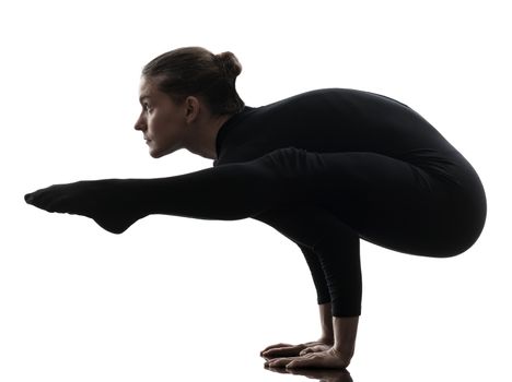 one caucasian woman contortionist practicing gymnastic yoga in silhouette  on white background