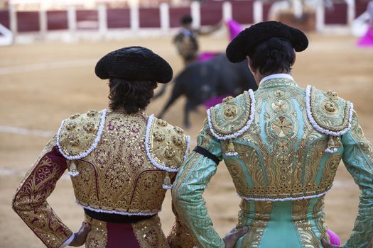  Ubeda, Jaen province, SPAIN - 29 september 2010: Spanish Bullfighters looking bullfighting, the Bullfighter on the left dressed in suit of lights of colors red and gold and the right color pistachio and gold in Ubeda, Jaen provincia, Andalusia, Spain