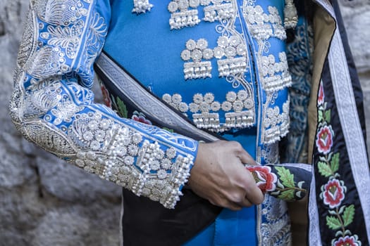 Ubeda, Jaen province, SPAIN - 29 september 2010: Spanish Bullfighter with blue dress and silver ornaments, the mantle is placed to start the paseillo before beginning the bullfighting in Ubeda, Jaen provincia, Andalusia, Spain