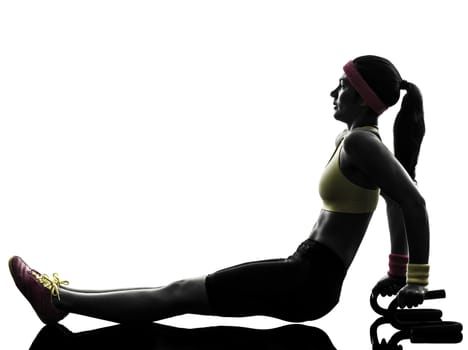 one woman exercising fitness push ups with holders in silhouette on white background
