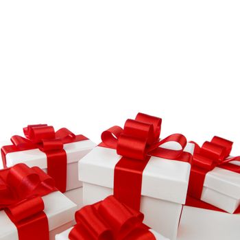 Gift boxes with red ribbon bows on white background