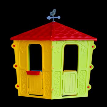 The Isolated plastic children's playhouse on black background
