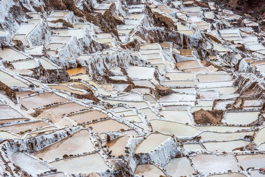 Maras salt mines in the peruvian Andes at Cuzco Peru