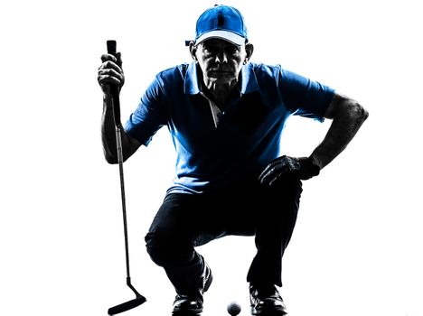 one man golfer golfing crouching in silhouette studio isolated on white background