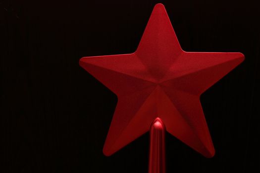 red star on a black background. Christmas toy