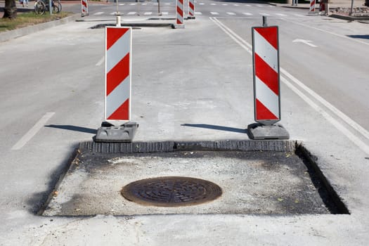  street repair, new asphalt with sewage wells