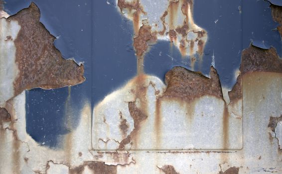 corroded surface with rust and peeling paint