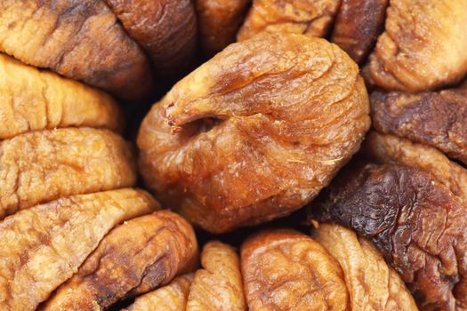 Delicious and sweet dried figs, food or fruit background