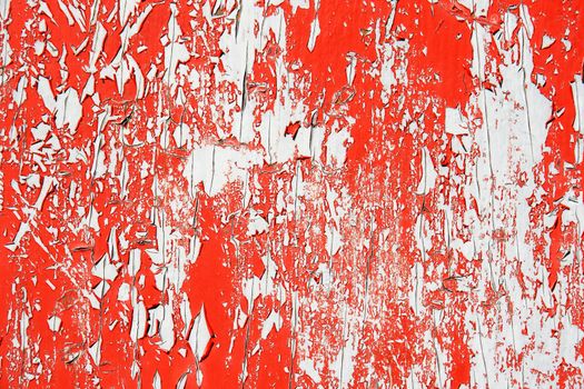 Peeling red paint over grey background, great texture