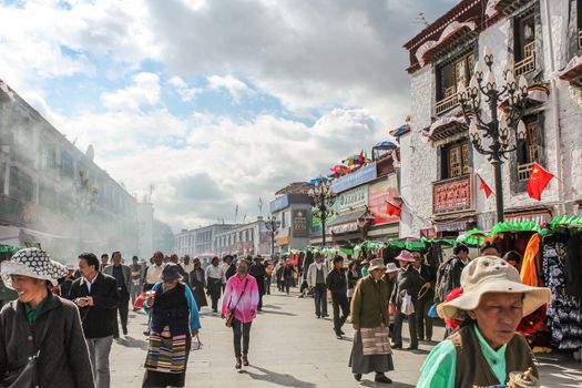 LHASA, TIBET, CHINA - SEPTEMBER 6: Busy old street with farmers markets, in Lhasa, Tibet, China, on September 6, 2013.