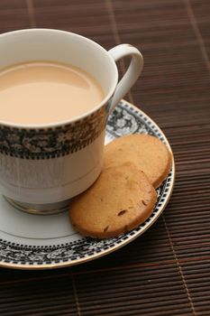A cup of tea with biscuits