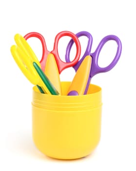 Some scissors in the container isolated on the white background