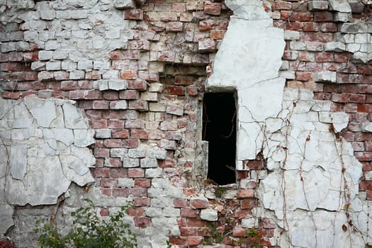 Broken window at the wall