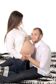 Happy men smiling with pregnant woman. Isolated on a white background.