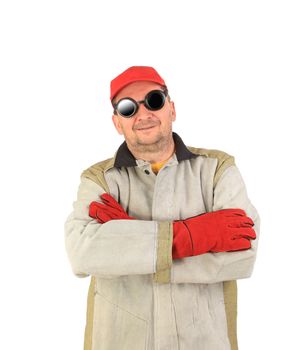 Smiling welder in glasses crosses arms. Isolated on a white background.