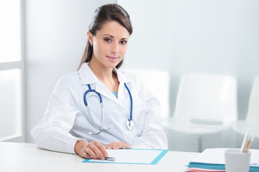 Portrait of a confident woman doctor sitting in her office