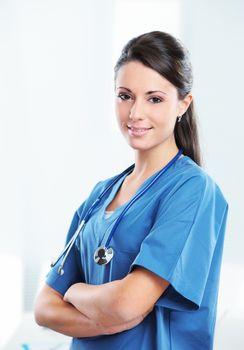 Portrait of a smiling woman doctor with her arms crossed