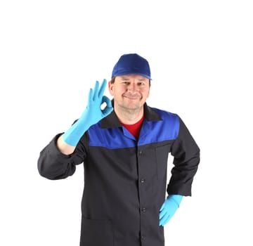 Worker with sign okey. Isolated on a white background.
