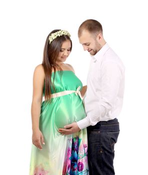 Happy couple expecting baby. Isolated on a white background.