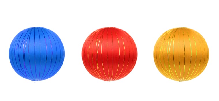 Red blue and yellow christmas balls. Isolated on a white background.
