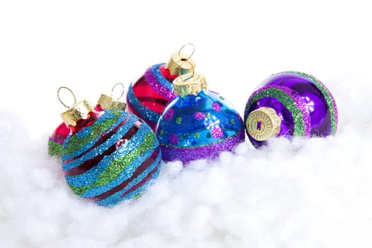 Colorful glitter Christmas balls over white background
