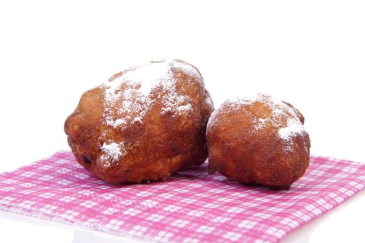 Two Dutch donut also known as oliebollen, traditional New Year's eve food isolated on white background