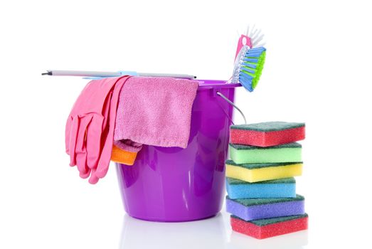 couple of colorful cleaning equipment over white background
