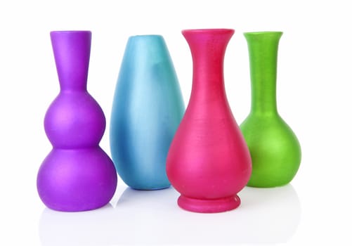 Four colorful empty vases over white background