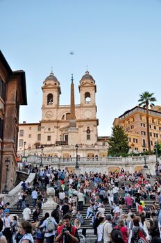 ROME - SEPTEMBER 20: People sitting on the Spanish Steps on September 20, in Rome, Italy. With 138 steps in total, the Spanish Steps of Rome are the longest and widest outdoor steps in Europe.