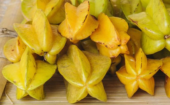 Fresh organic star apple fruit in market, Thailand.