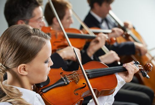 Cellist and violinist playing at the concert