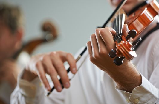  Violinist playing at the concert, close up