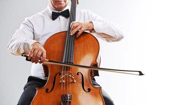 Close up image of a man playing cello