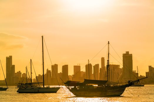 Boats and skyscrapers at sunset in Cartagena, Colombia