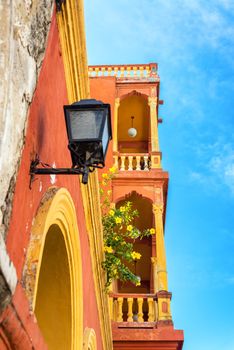 Orange and yellow balconies in the neighborhood of Getsemani in the historic city of Cartagena, Colombia