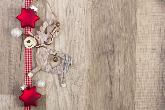 moravian stars red with moose on wooden background