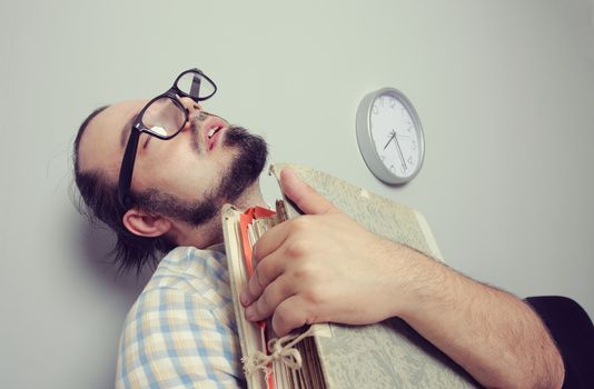 Bizarre Man sleeps in a waiting room chair