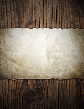 Old paper on wooden background with detail texture