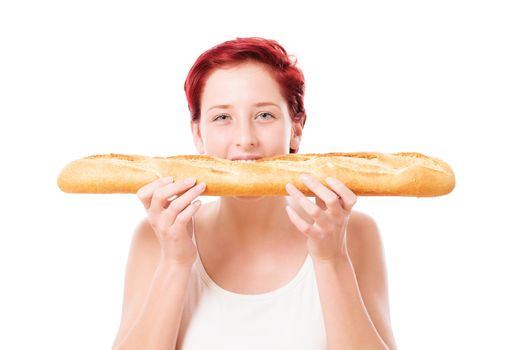 redhead woman bites in a baguette bread from side on white background