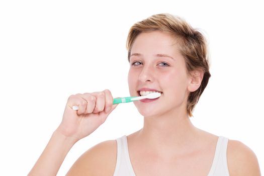 young blonde woman brushing her teeth on white background