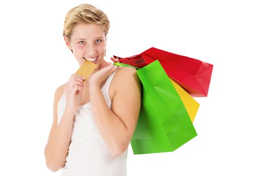 happy blonde shopping woman bites on her golden credit card on white background