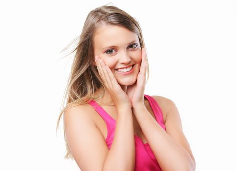 Positive, blonde girl smiling on a white background 