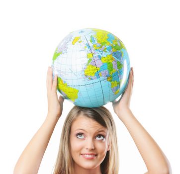 Portrait of a happy blonde girl  holding a world globe against white background 