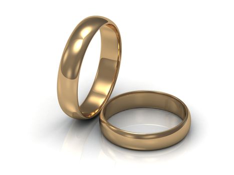 Gold ring near the ring. 2 wedding rings on a white background