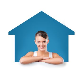 Attractive young woman looking through House sign 