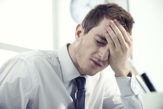 A Young businessman man with a headache