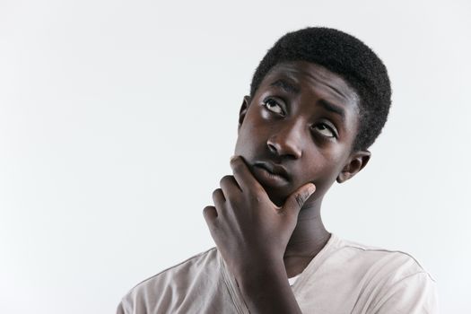 Portrait of an african boy looking up at the copy space
