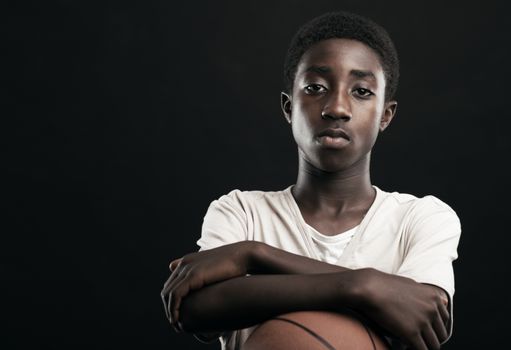 Portrait of african boy with basket ball